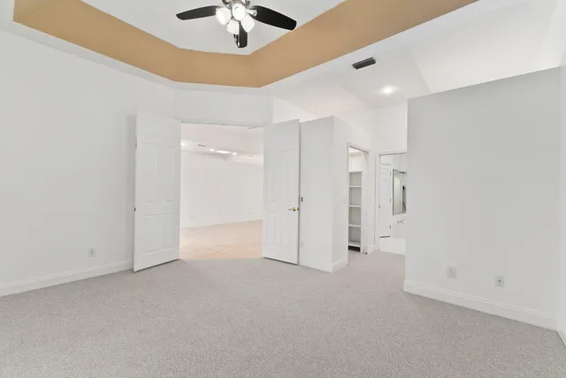 a bathroom with a tub shower and vanity