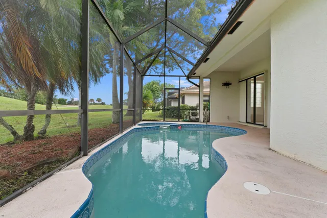 a view of a house with a yard porch and sitting area