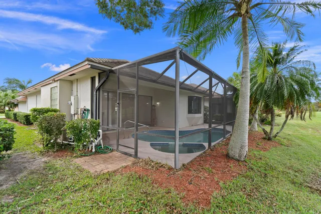 an aerial view of a house with a big yard