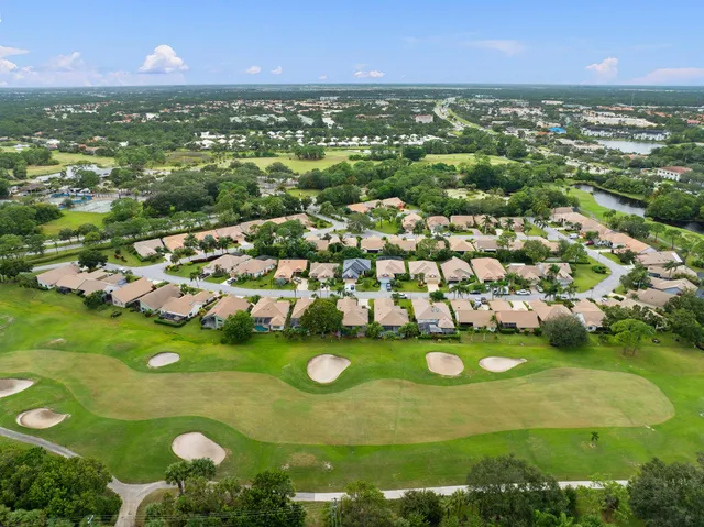 an aerial view of a house with a lake view