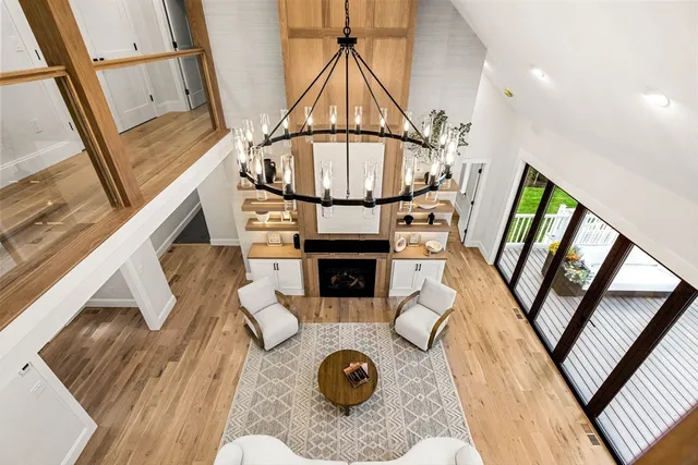 a view of living room with furniture and a fireplace