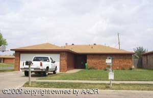 5301 Capulin Lane Amarillo, TX 79110 - Photo 1 of 18 a front view of a house with a garden