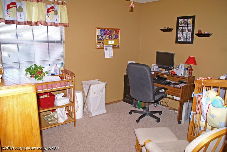 5301 Capulin Lane Amarillo, TX 79110 - Photo 13 of 18 a view of a workspace with furniture and toys