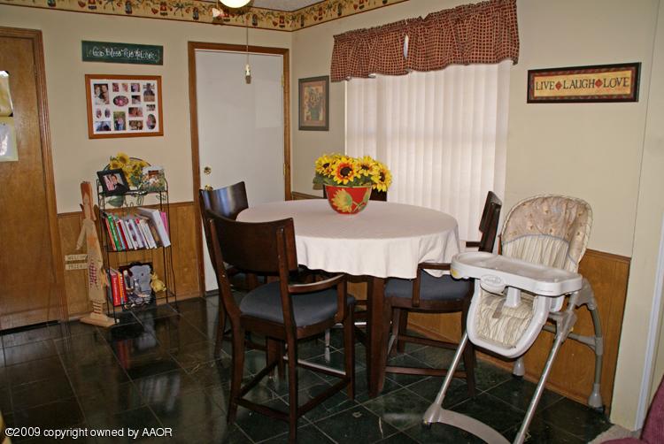 5301 Capulin Lane Amarillo, TX 79110 - Photo 8 of 18 a view of a dining room with furniture and wooden floor