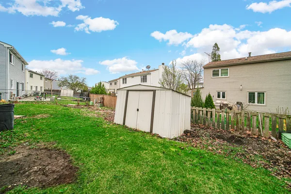 a view of a back yard of the house