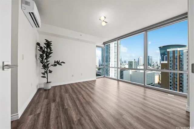 wooden floor in an empty room with a window