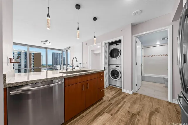 a kitchen with kitchen island a sink appliances and cabinets