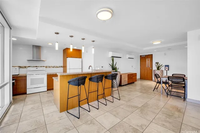 a kitchen with stainless steel appliances kitchen island granite countertop a sink and cabinets