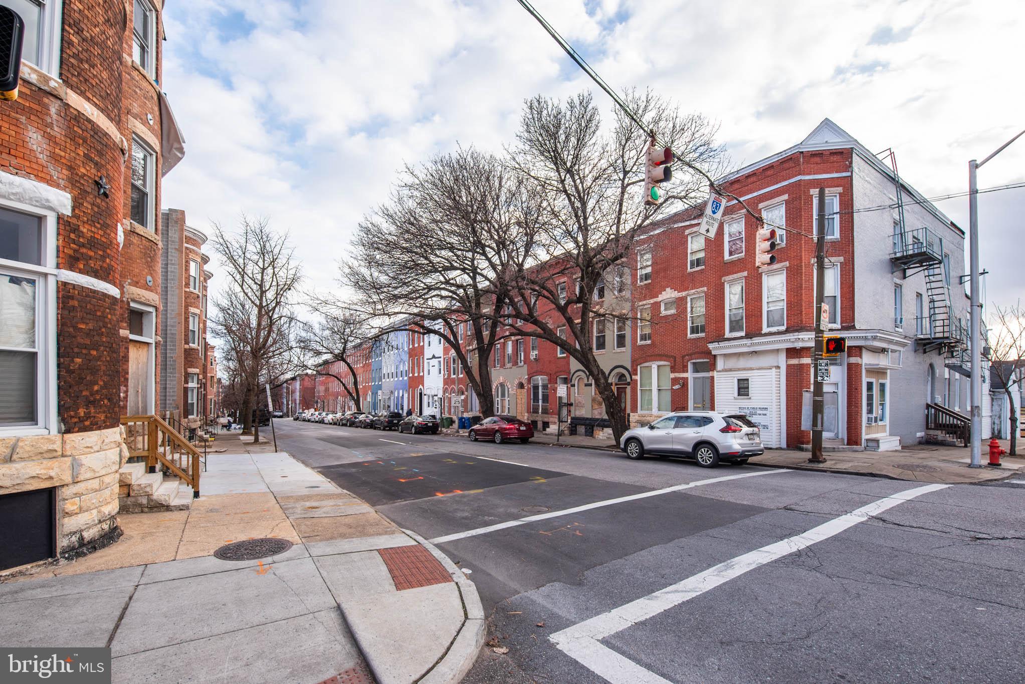 2143 Druid Hill Avenue, Unit 2 Baltimore, MD 21217 - Photo 16 of 20 a city street lined with buildings and cars
