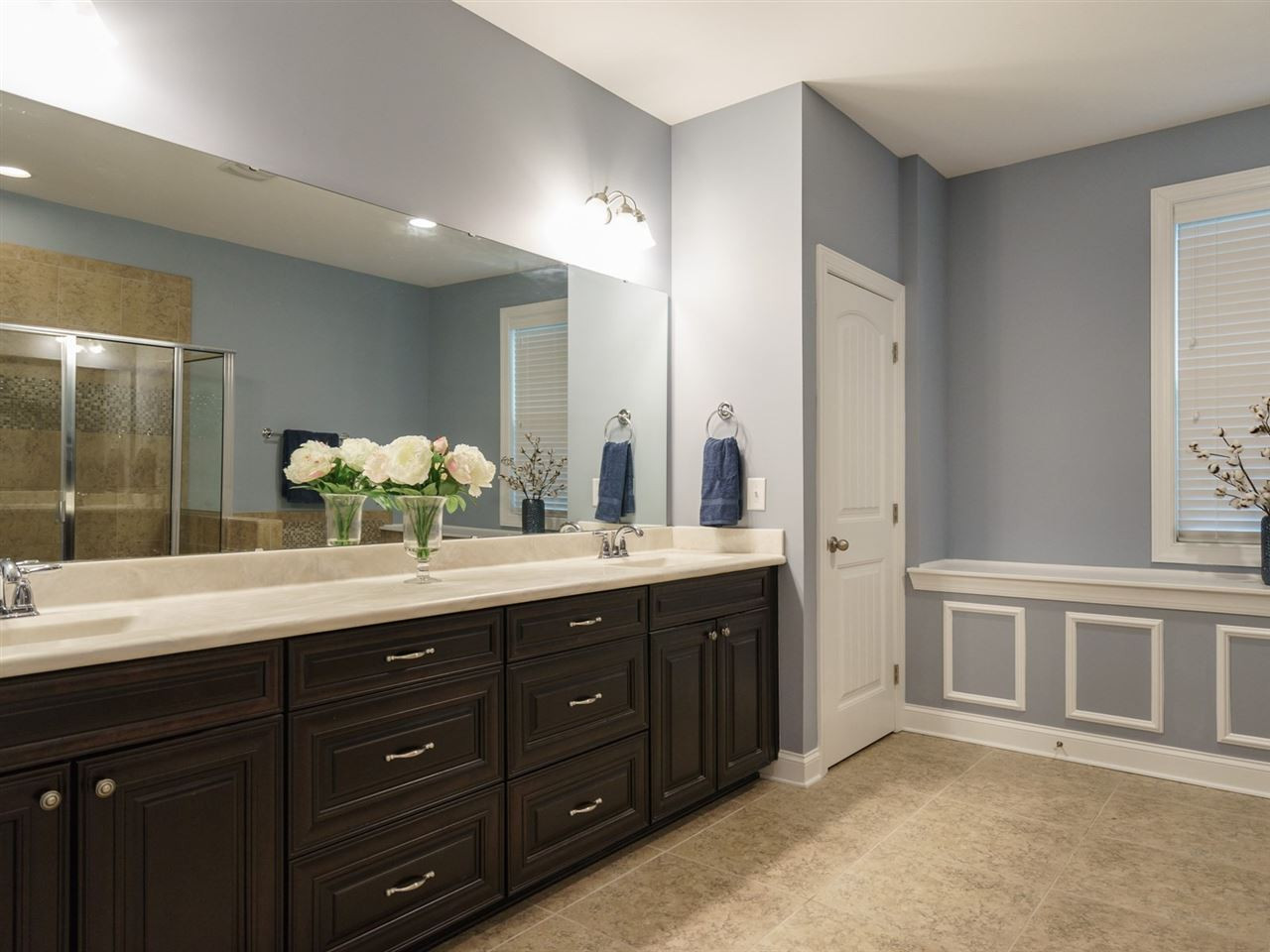 4844 Inwood Road Raleigh, NC 27603 - Photo 12 of 25 The master suite boasts a large bathroom a dual vanity plus his and hers' walk-in-closets. Master Suite