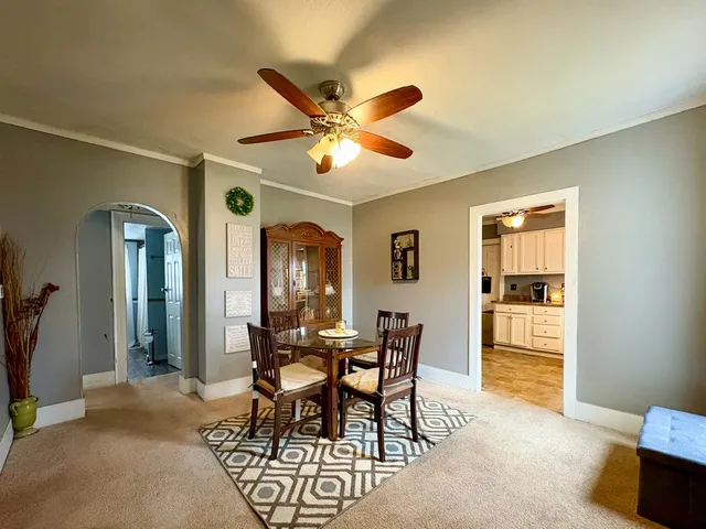 a dining room with furniture and window