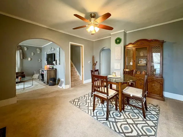 a dining room with furniture and window