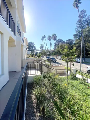 a view of balcony with outdoor seating and city view