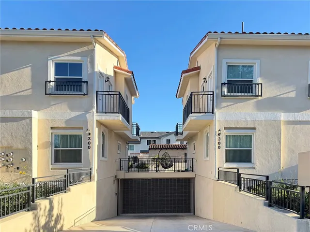 a front view of a house with large windows