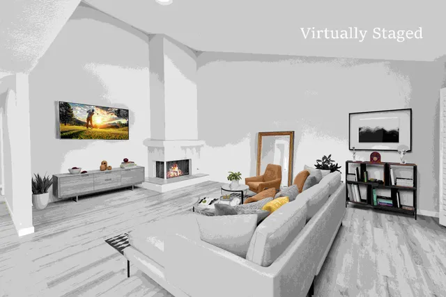 a view of empty room with wooden floor and fireplace