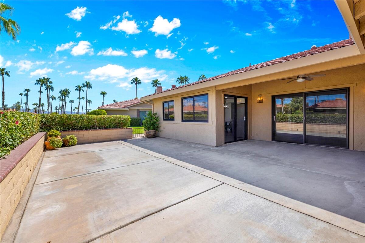 49 Maximo Way Palm Desert, CA 92260 - Photo 26 of 33 a view of a house with a garage and balcony