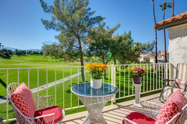 a view of a chairs and table in the patio