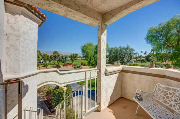 a view of balcony with furniture