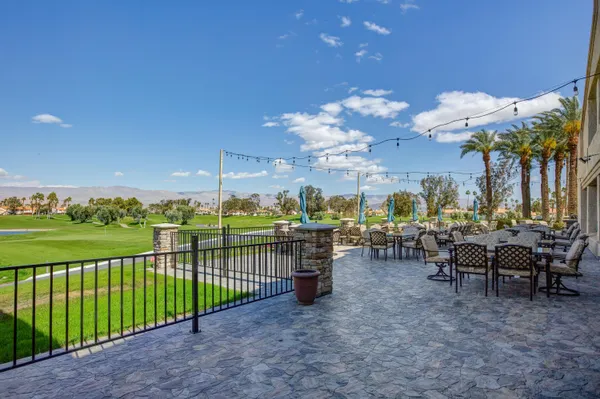 a view of a chairs and tables in the patio