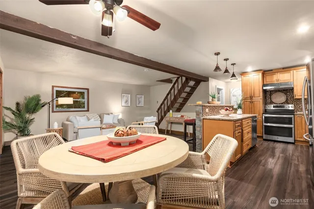 a view of a dining room with furniture window and wooden floor