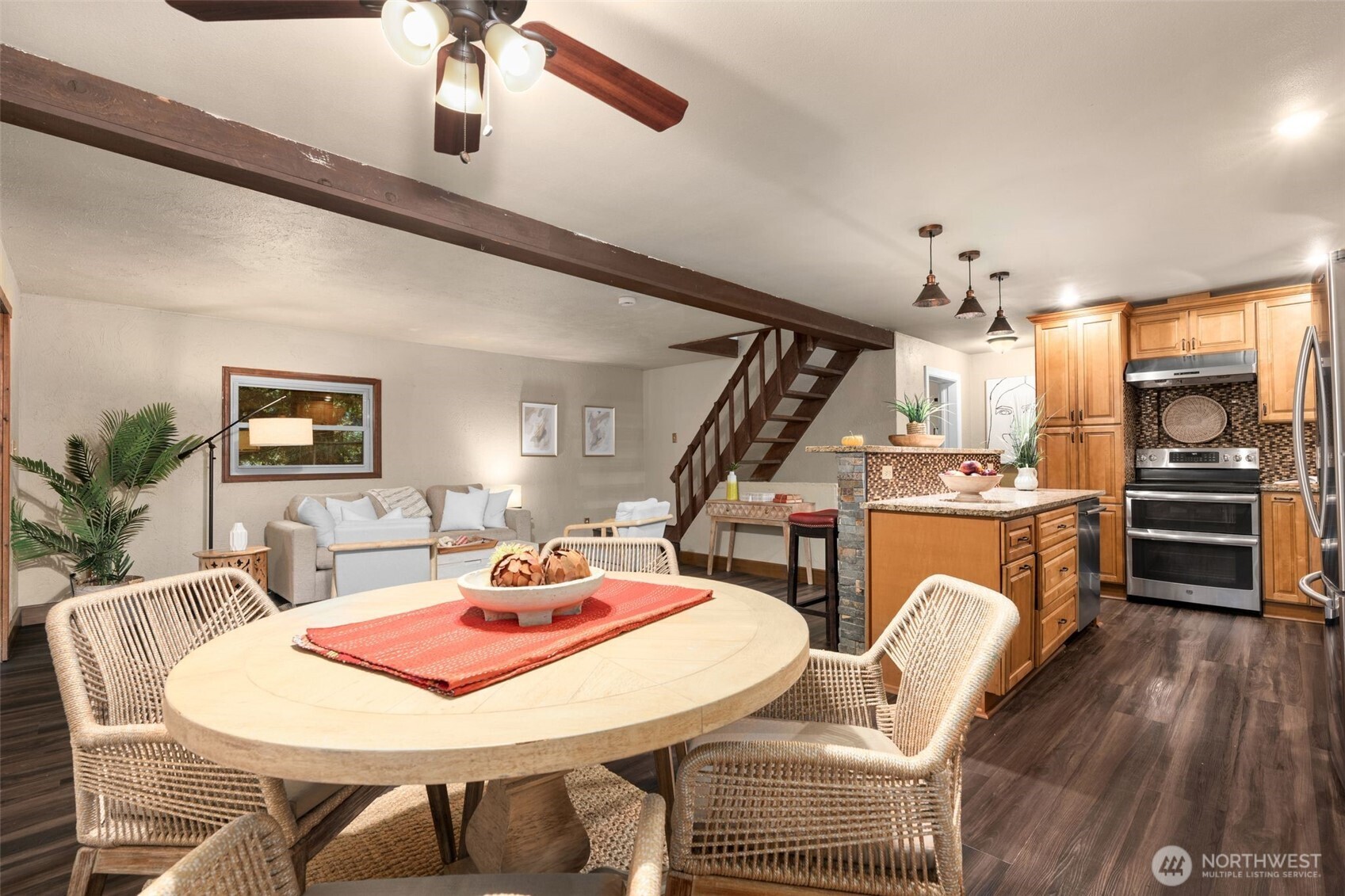 19124 Southeast 213th Street Renton, WA 98058 - Photo 11 of 33 a view of a dining room with furniture window and wooden floor
