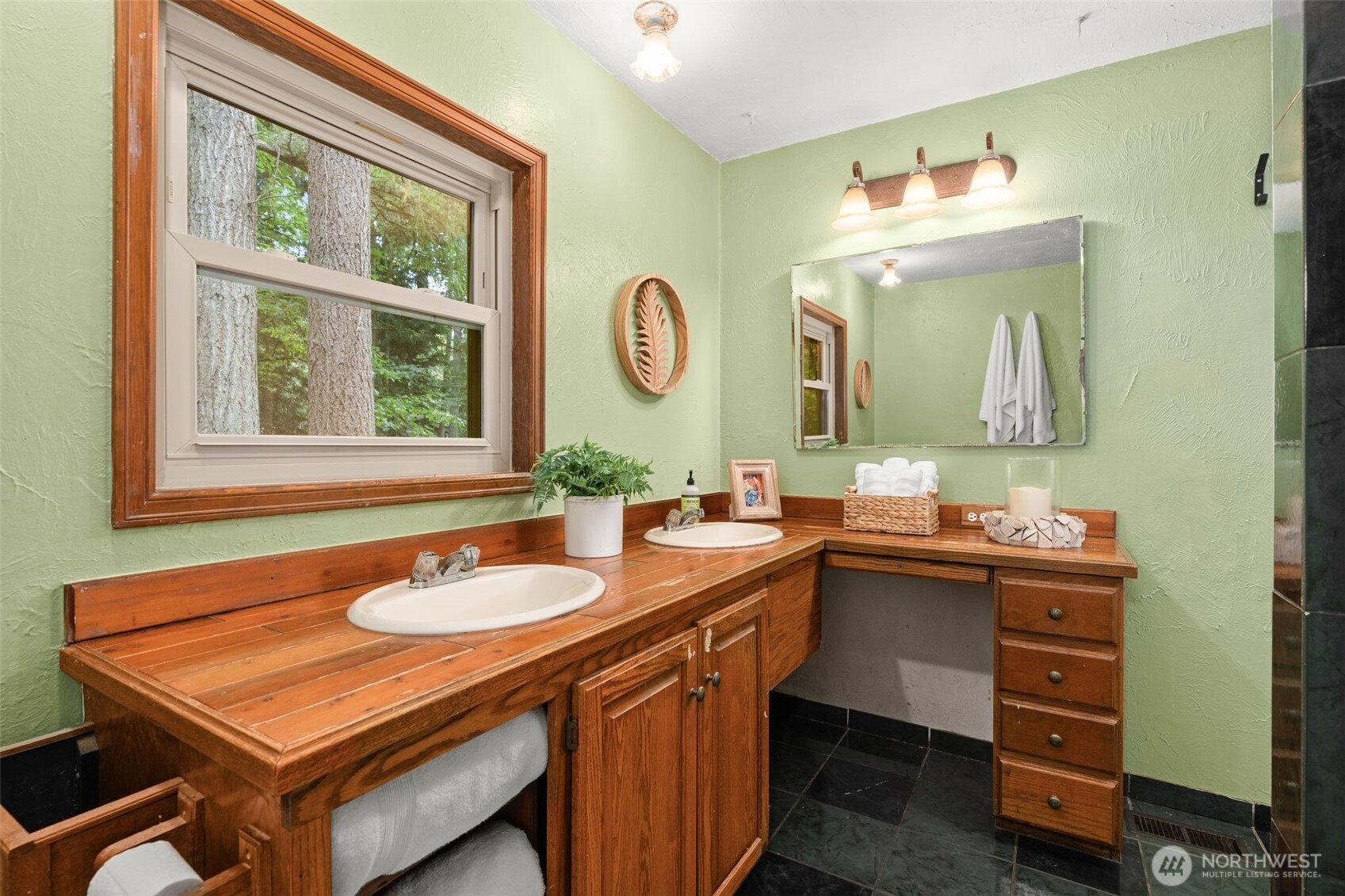 19124 Southeast 213th Street Renton, WA 98058 - Photo 17 of 33 a bathroom with a sink a vanity and a mirror