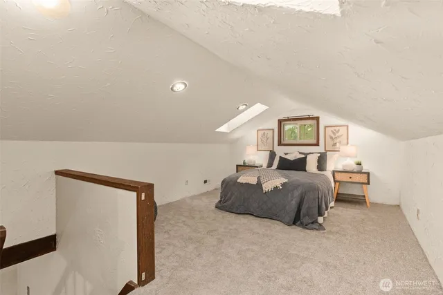 a bedroom with a bed and cabinets