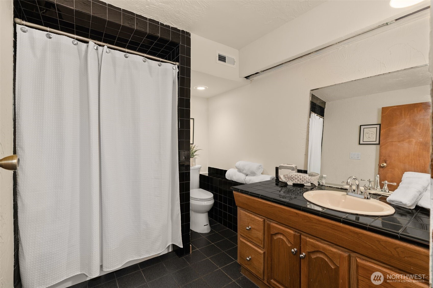 19124 Southeast 213th Street Renton, WA 98058 - Photo 23 of 33 a bathroom with a granite countertop sink and a mirror