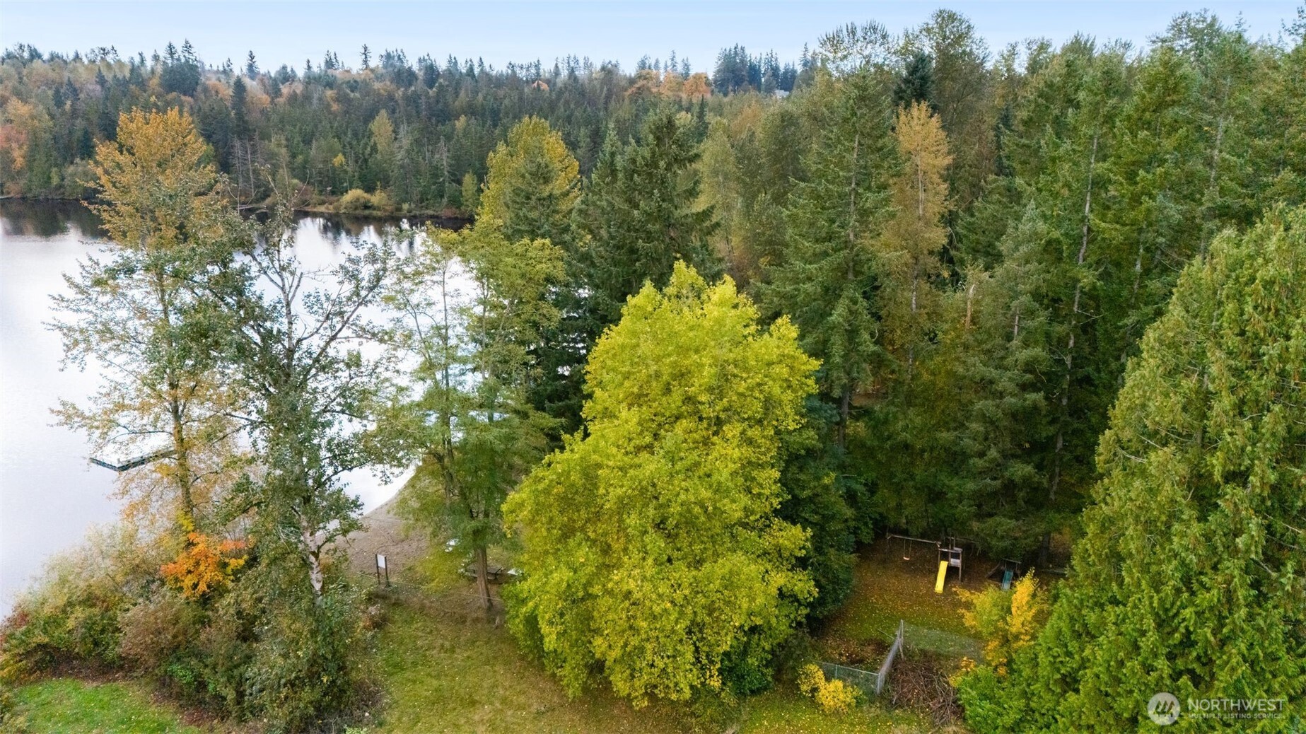 19124 Southeast 213th Street Renton, WA 98058 - Photo 31 of 33 a view of a lake with a house in the background