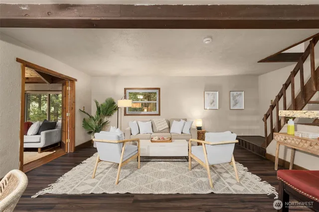 a living room with furniture and a rug