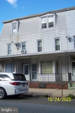 a view of a car parked in front of a building