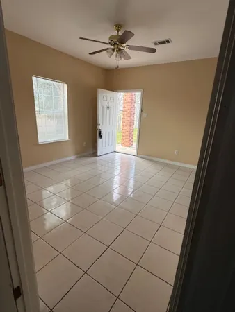 a view of an empty room with a window