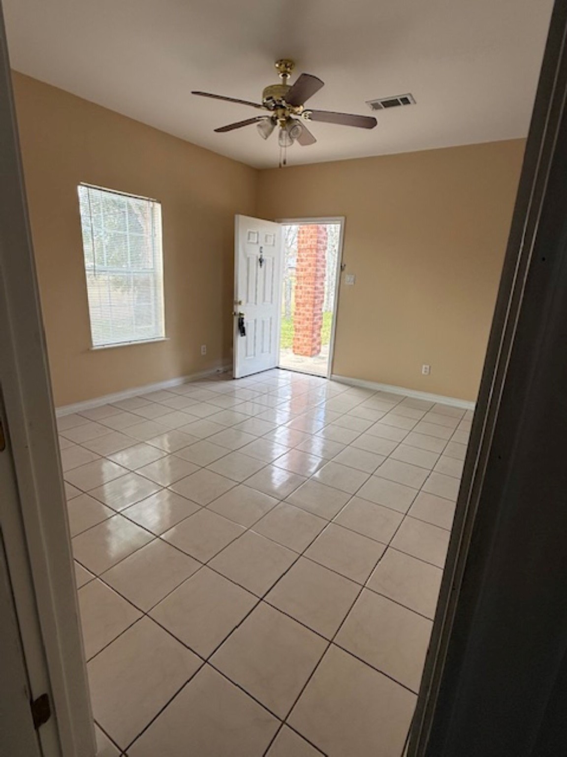 702 Staitti Street, Unit C Humble, TX 77338 - Photo 9 of 14 a view of an empty room with a window