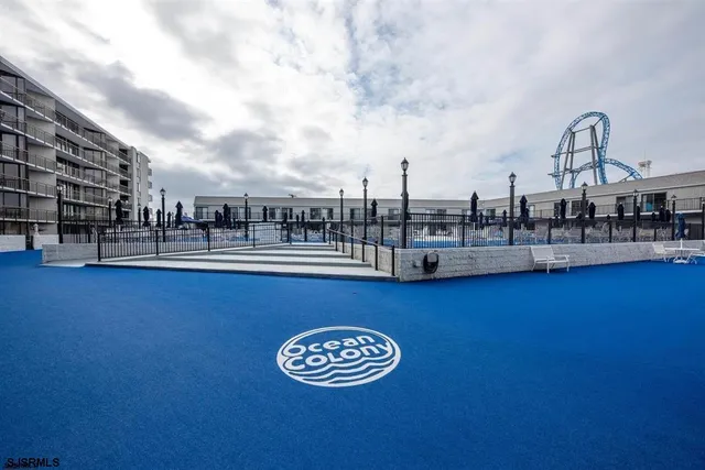 a view of a swimming pool with an outdoor seating