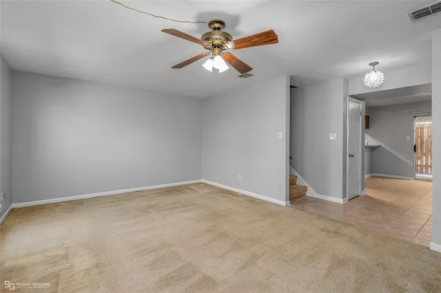 a bathroom with a granite countertop sink a toilet and mirror
