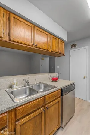 a kitchen with stainless steel appliances granite countertop a stove and a refrigerator