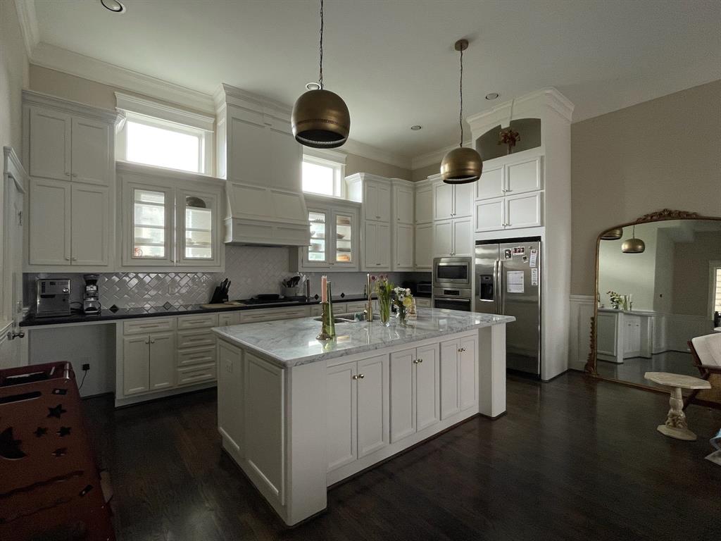 Large east facing kitchen with plenty of cabinetry and bright morning light