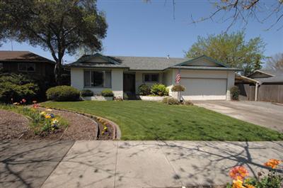 1253 St Francis Road Santa Rosa, CA 95409 - Photo 1 of 12 a front view of a house with a yard and garage