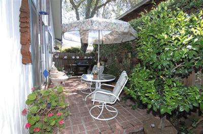 1253 St Francis Road Santa Rosa, CA 95409 - Photo 8 of 12 a patio with table and chairs and potted plants