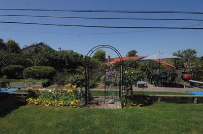 1253 St Francis Road Santa Rosa, CA 95409 - Photo 10 of 12 a front view of a house with a garden