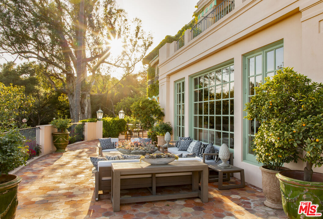670 Hot Springs Road Montecito, CA 93108 - Photo 12 of 36 a view of a patio with couches and potted plants