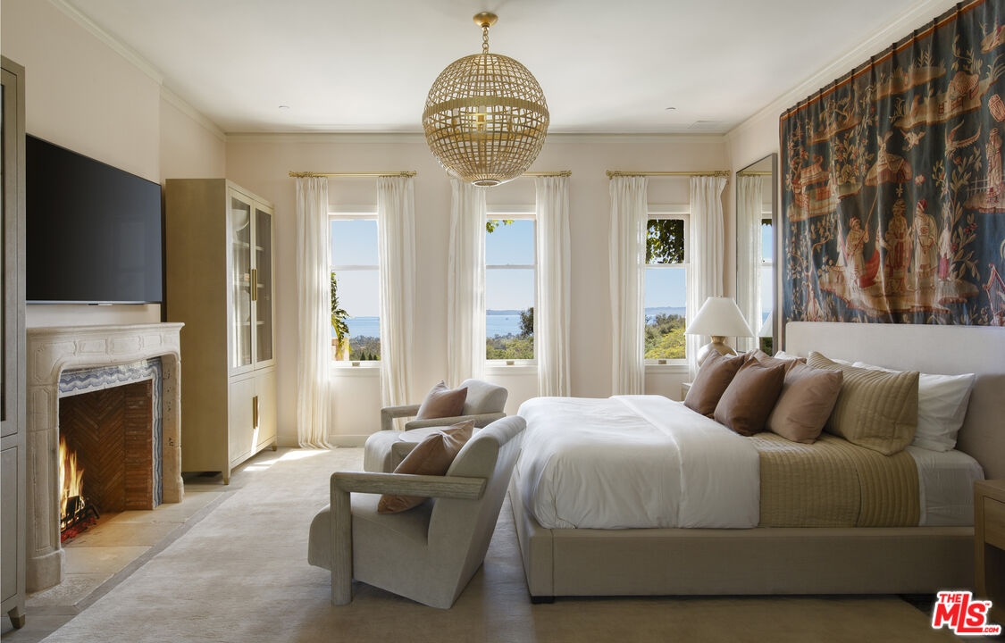 670 Hot Springs Road Montecito, CA 93108 - Photo 17 of 36 a bedroom with a bed and a television