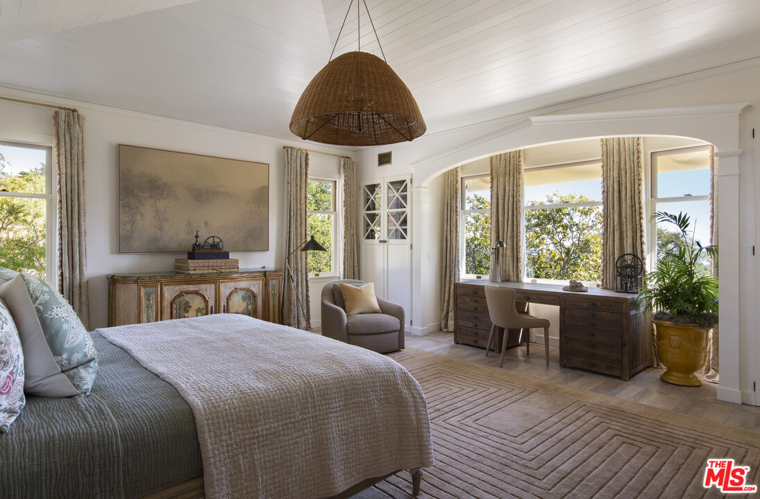 670 Hot Springs Road Montecito, CA 93108 - Photo 19 of 36 a bedroom with a large bed and a large window