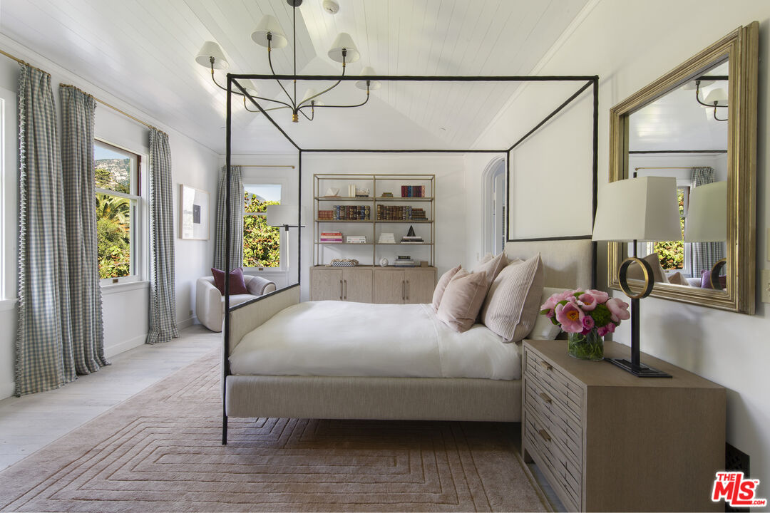 670 Hot Springs Road Montecito, CA 93108 - Photo 21 of 36 a bedroom with a bed window and walk in closet