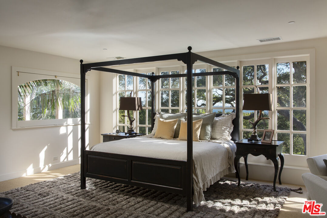 670 Hot Springs Road Montecito, CA 93108 - Photo 31 of 36 a bedroom with furniture and a window