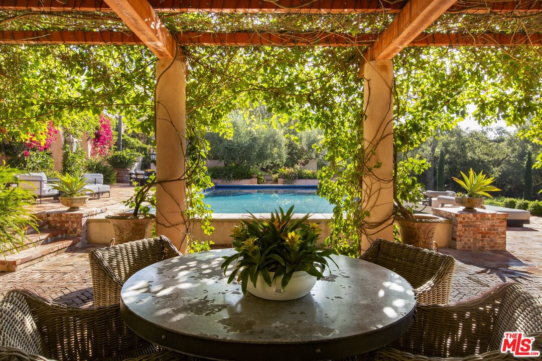 670 Hot Springs Road Montecito, CA 93108 - Photo 33 of 36 a view of a chairs and table in the patio