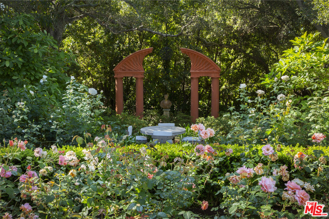 670 Hot Springs Road Montecito, CA 93108 - Photo 34 of 36 a view of a house with a tree and flower garden