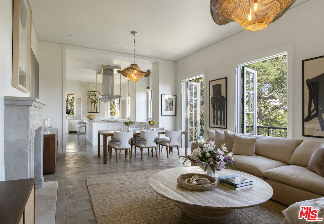 670 Hot Springs Road Montecito, CA 93108 - Photo 6 of 36 a living room with fireplace furniture and a large window
