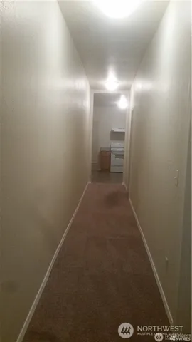 a kitchen with a stove and a refrigerator