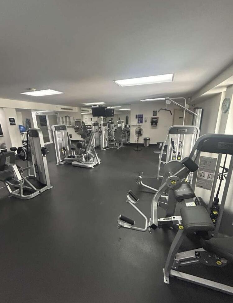 111 Briny Avenue, Unit 703 Pompano Beach, FL 33062 - Photo 14 of 19 a view of a room with gym equipment